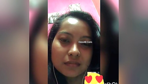 Brunette Indian chick in a bikini shows boobs on web camera