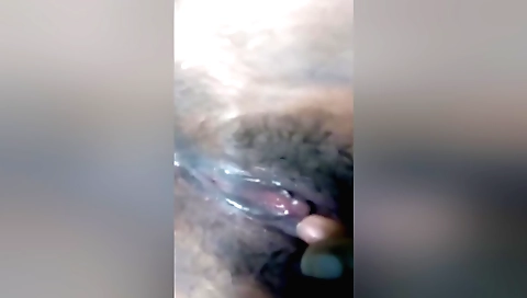 Hairy girl with large tits and a big ass gets naked