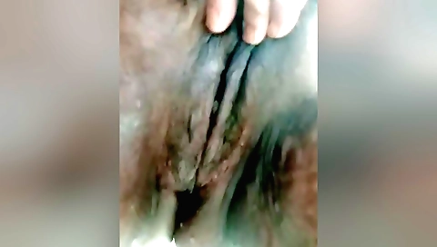 Busty brunette enjoys solo masturbation with her pussy