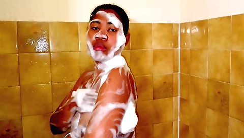 Indian babe takes a hot shower and moans in excitement