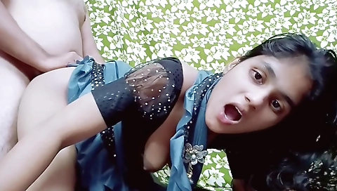 Indian teen in red dress and white blouse in a bedroom vid