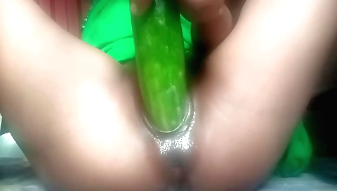 Indian teen plays with cucumber after playing with a toy
