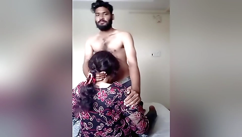 Indian teen in a traditional dress in a hotle room