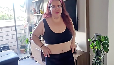 Big ass redhead in red dress plays with her tits in bed
