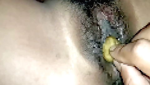 Indian brunette with a hairy pussy is fingering a toy