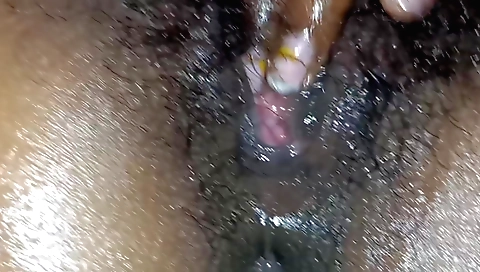 Indian girl plays with her hairy pussy on a hot night