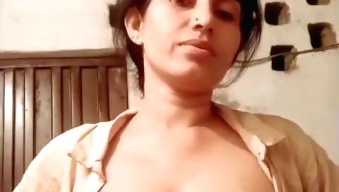 Big tits brunette milf shows her nice boobs in solo video