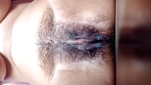 Hairy indian chick is alone in her bedroom and masturbates