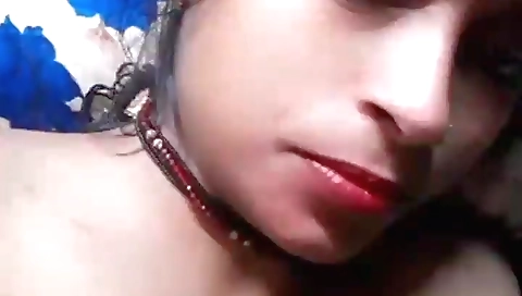 Brunette is in her phone while playing with camera