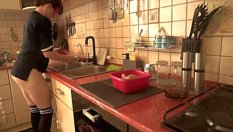 Busty maid in lingerie and stockings in the kitchen