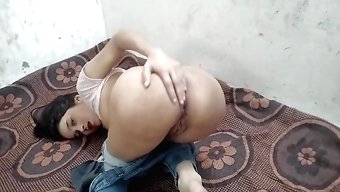 Indian brunette masturbates on her bed in various ways