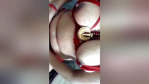 Gorgeous brunette with large tits gets nude in the bathroom